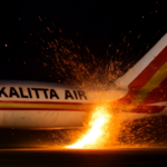Sparks Erupt Following Tail Strike of Kalitta Air Boeing 777-300 at Cincinnati Airport